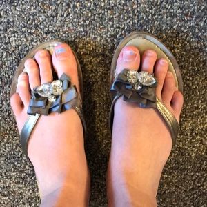 Guess silver bow and rhinestone flip flops